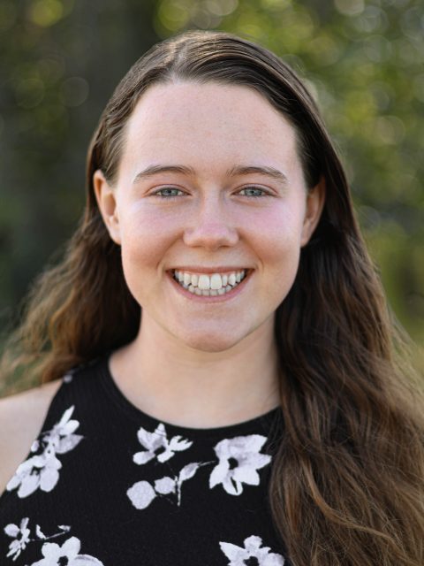 Image of Michigan State University student Elena Forman smiling in a floral top.