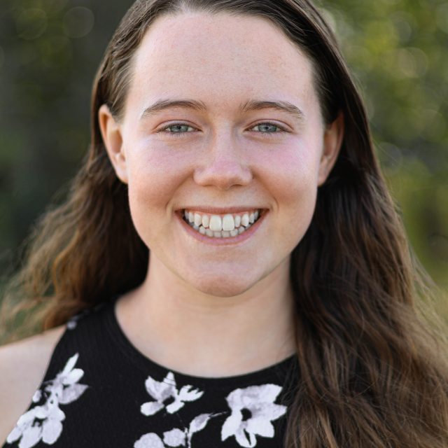 Image of Michigan State University student Elena Forman smiling in a floral top.