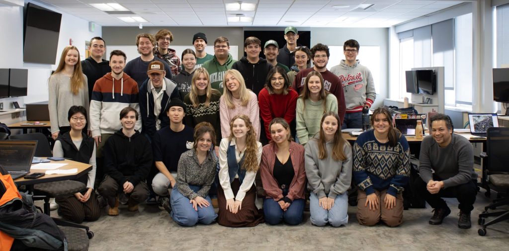 Image of Michigan State University student Ashlin Stover with a group of other students on the 2025 Human Rights Data Science Lab. The group is posed together and smiling in casual clothing.